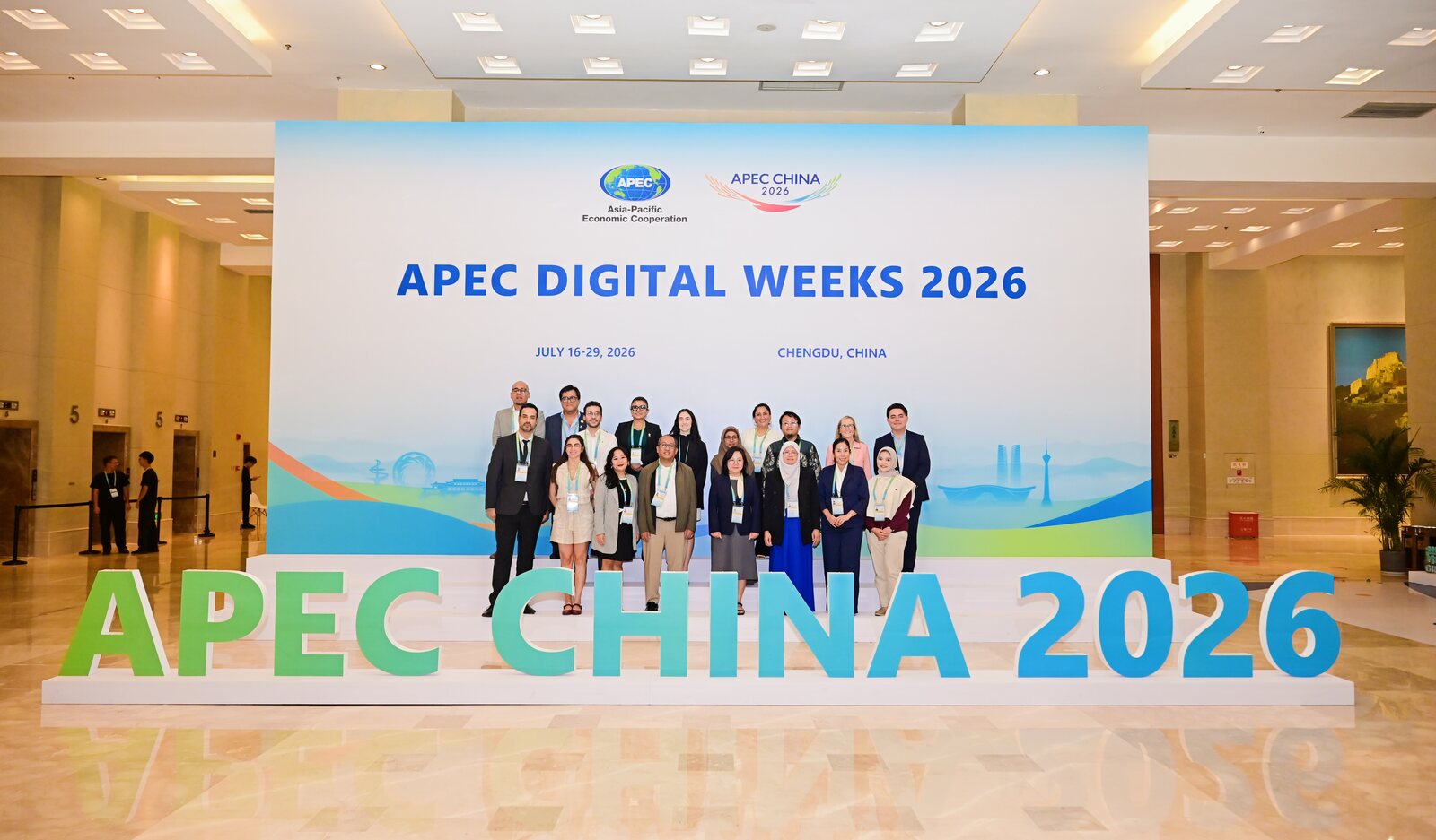 Participants of APEC Digital Weeks 2026 in front of the APEC China 2026 backdrop, Chengdu